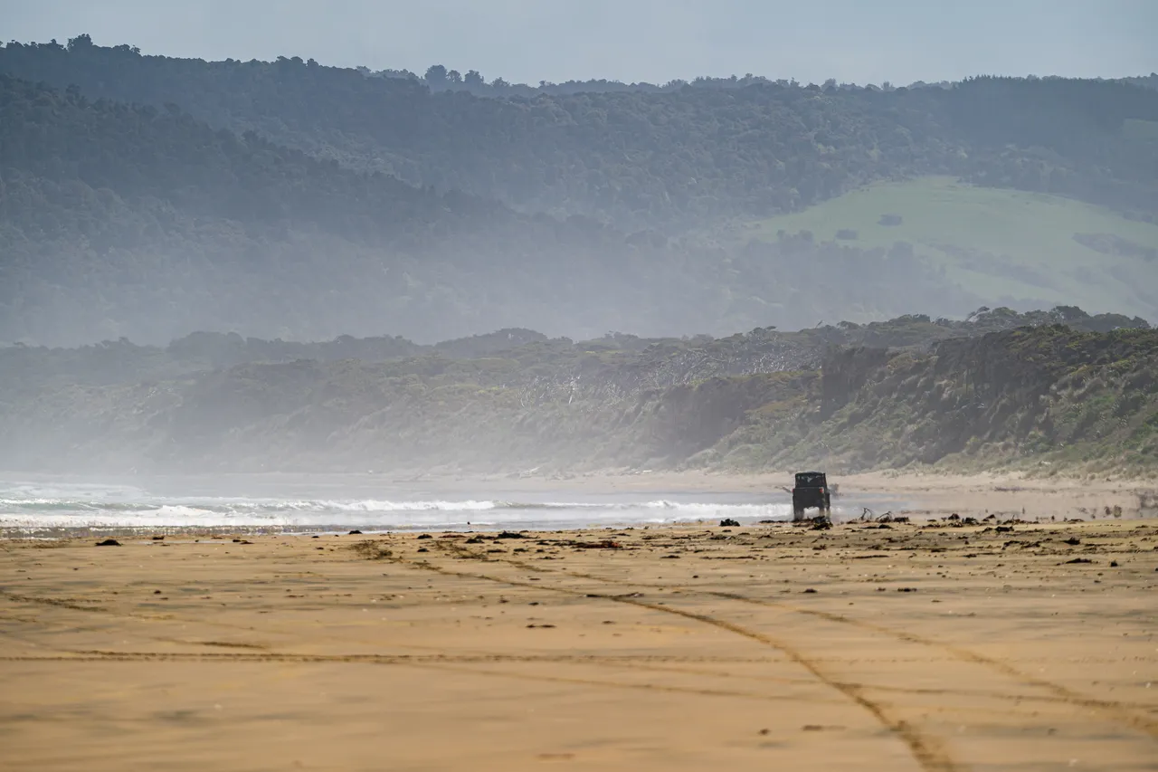 Side by side driving on the beach