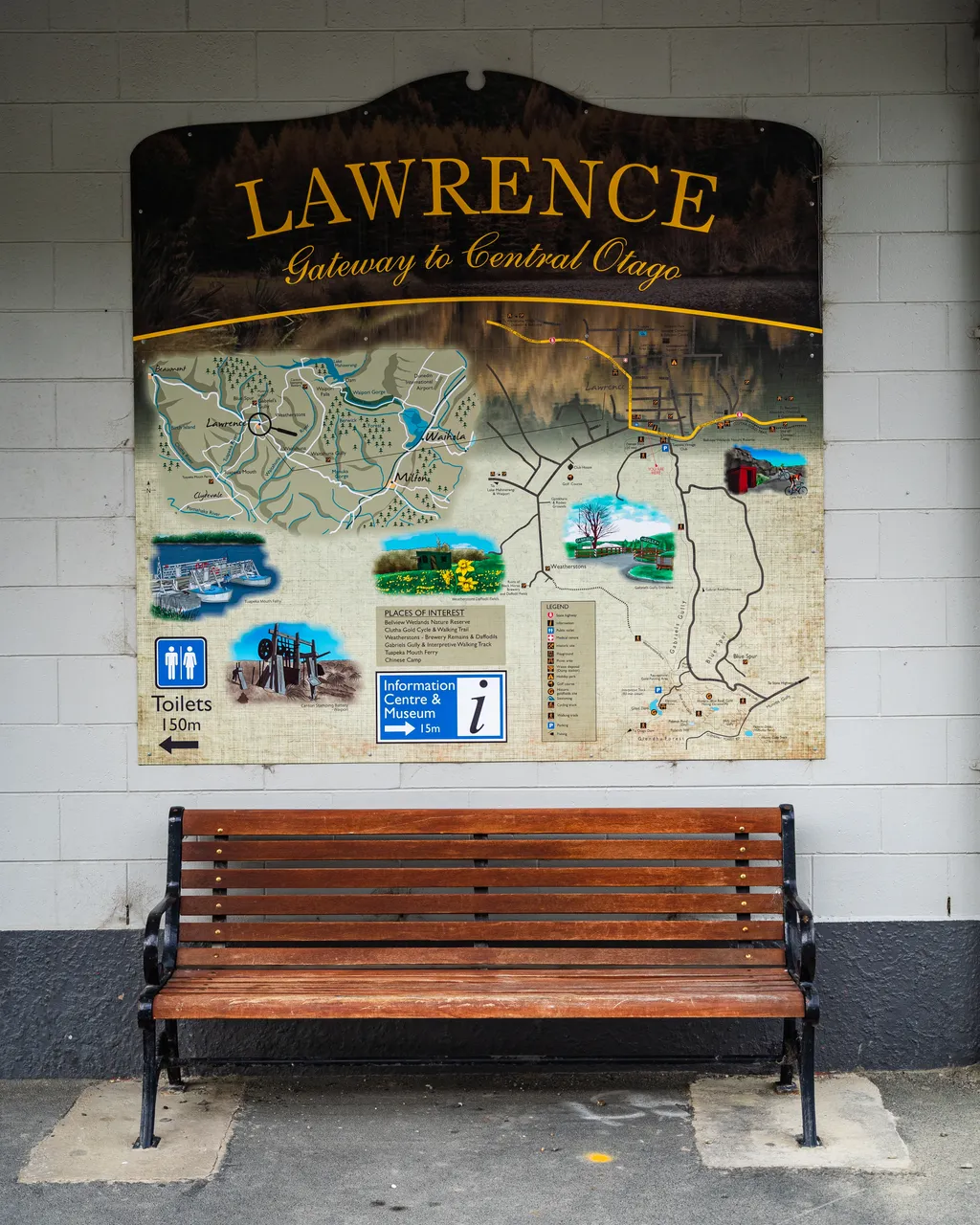 Bench under a map of Lawrence
