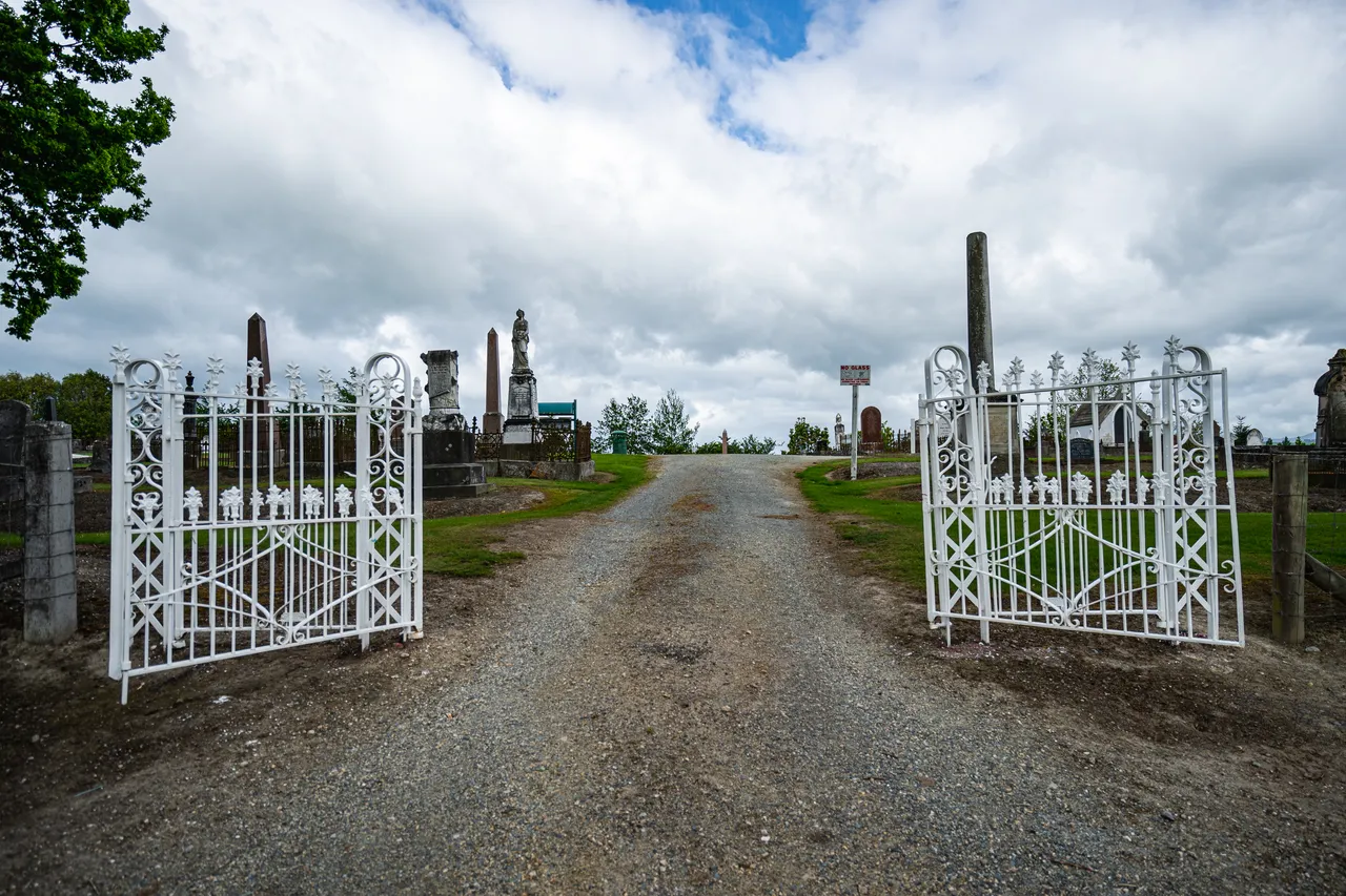 Entrance gate and gravel road