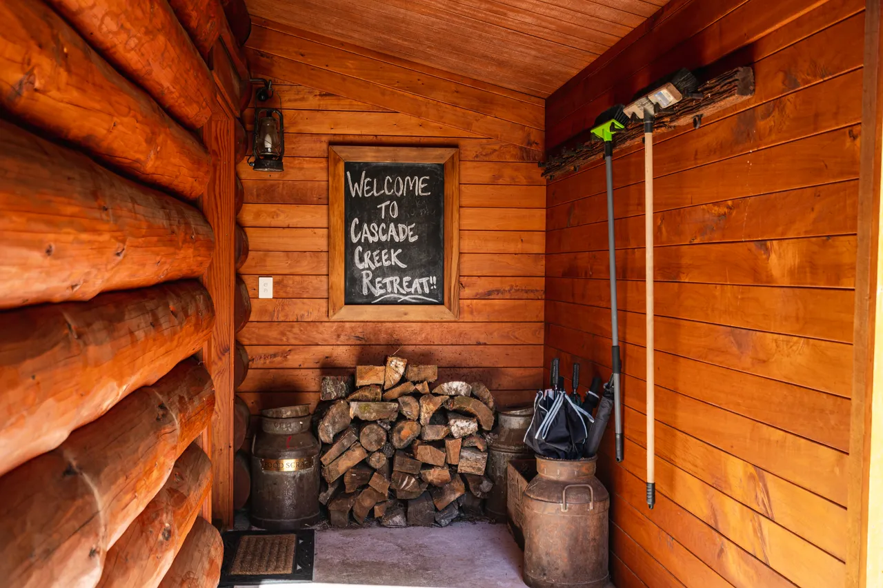 Welcome sign and firewood