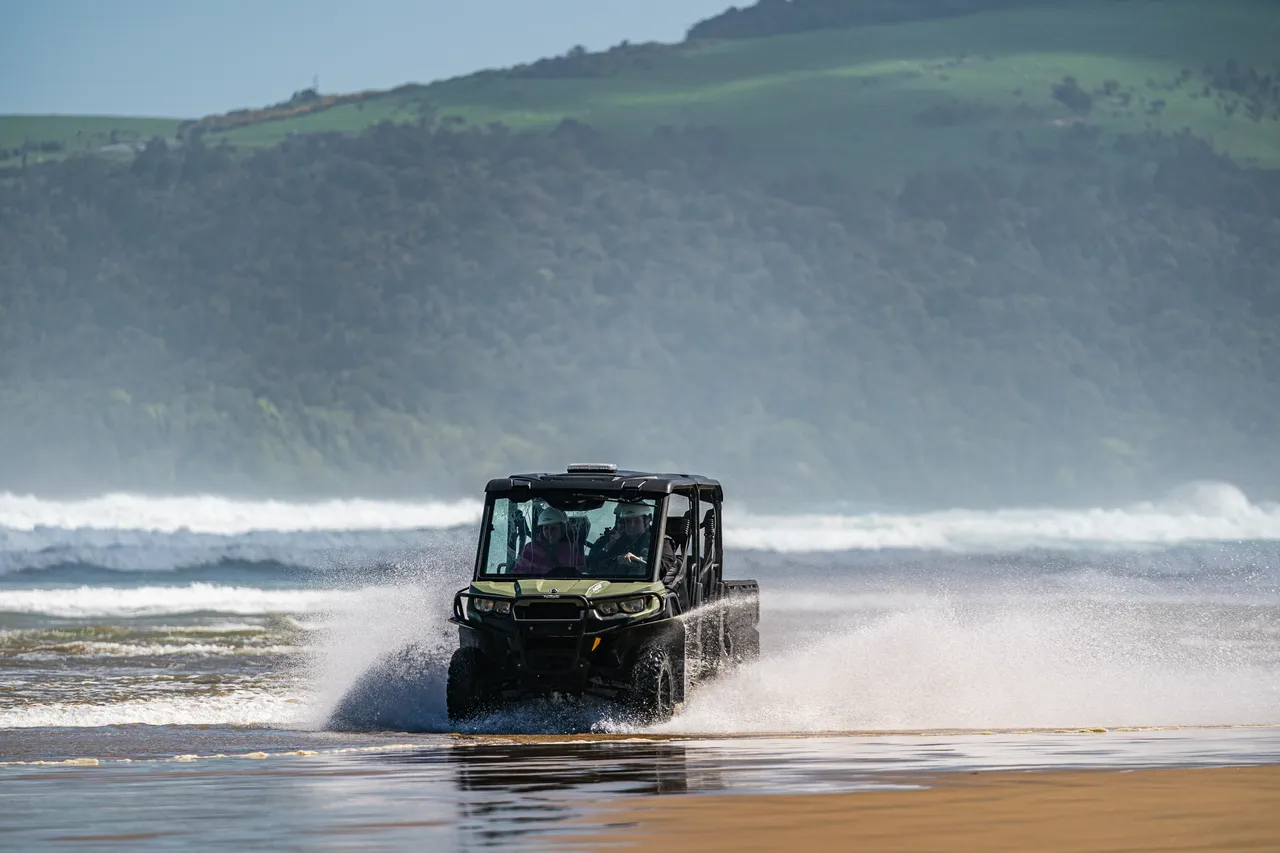Side by side driving on beach