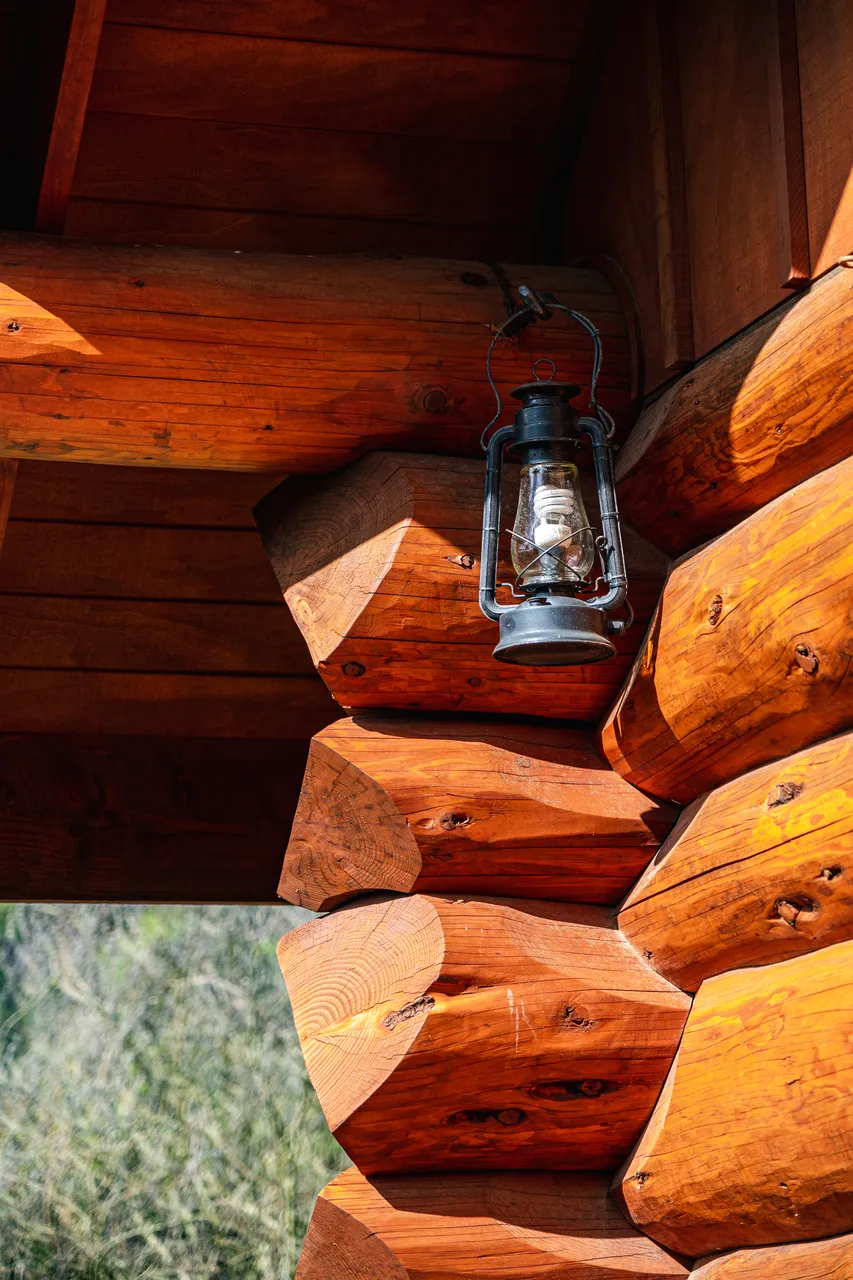 Details of log cabin and lamp