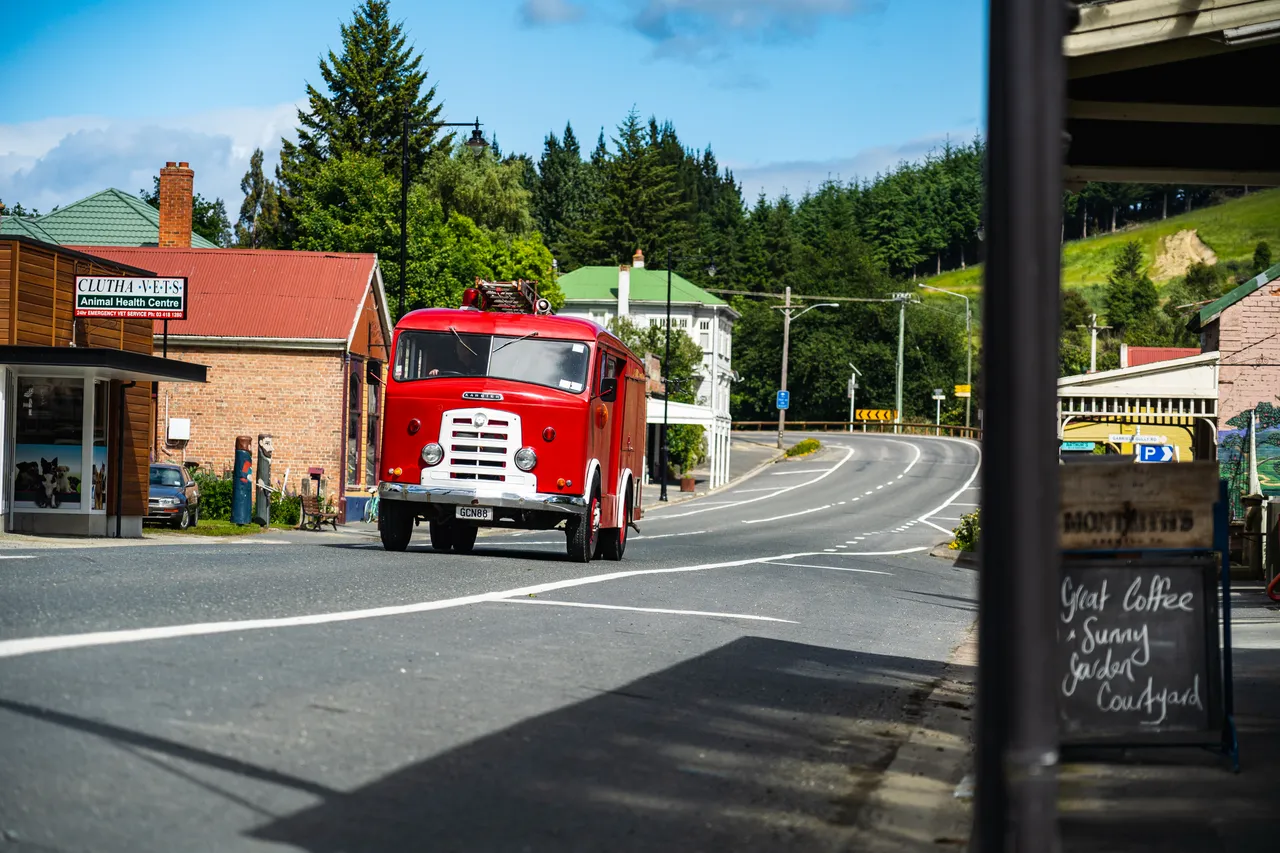 Old firetruck driving through Lawrence