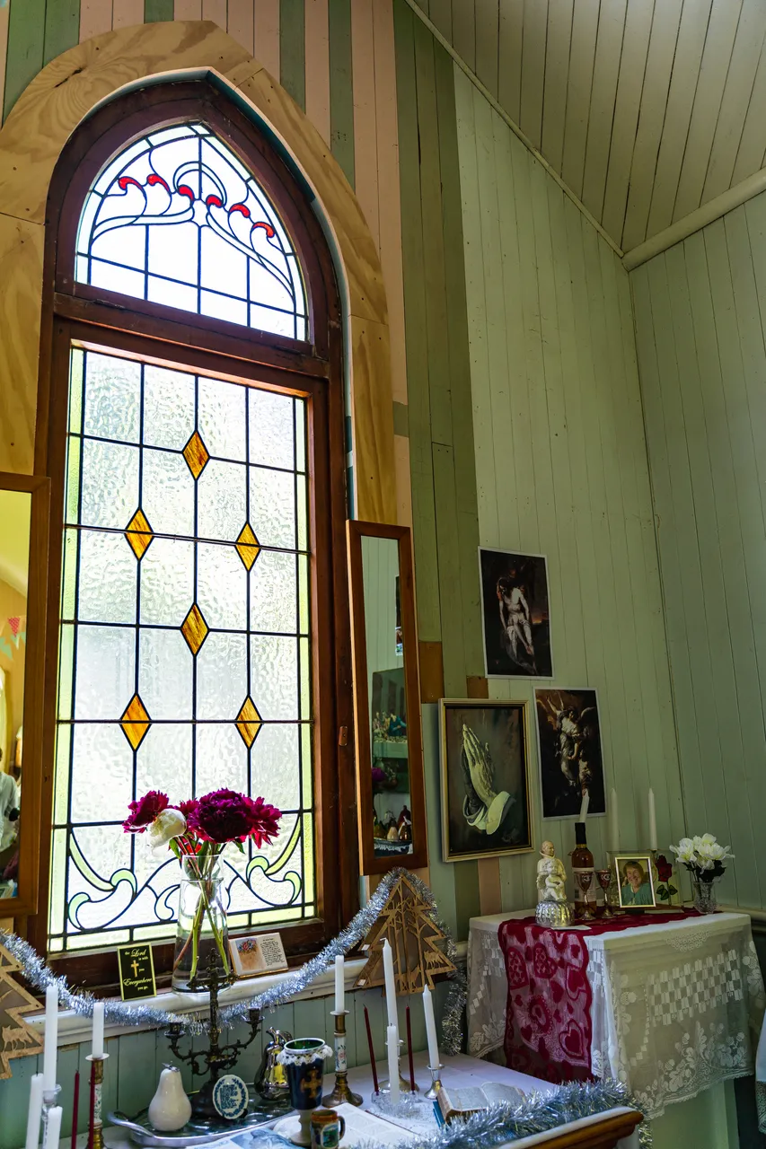 Stained glass window and candles