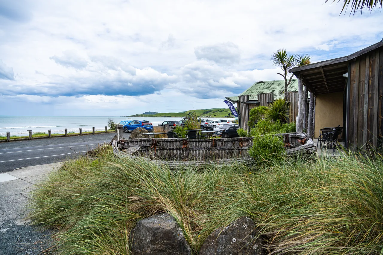 Buildings and grass and the sea