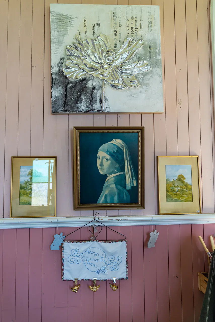 Artwork on pink wall