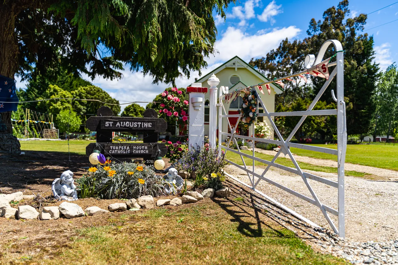 White gate and sign