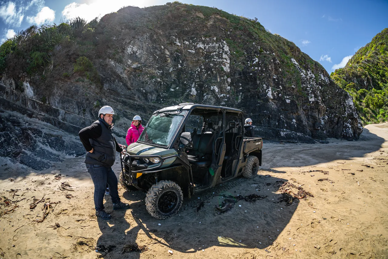 People and side by side parked on beach
