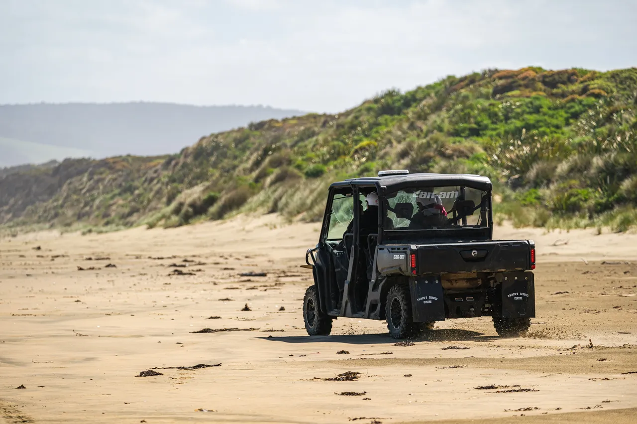 Side by side driving on beach