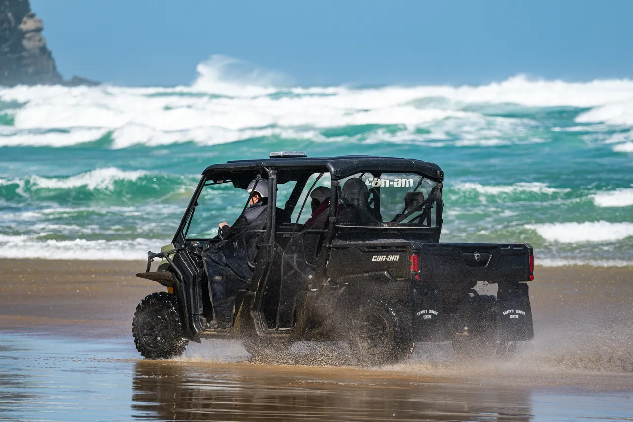 Side by side driving on beach