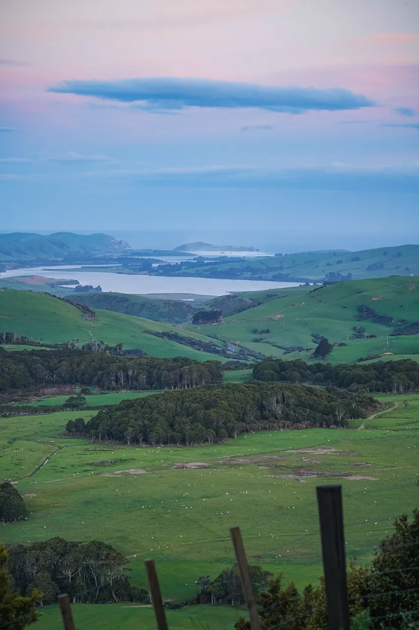 View of farmland and sunset and sea