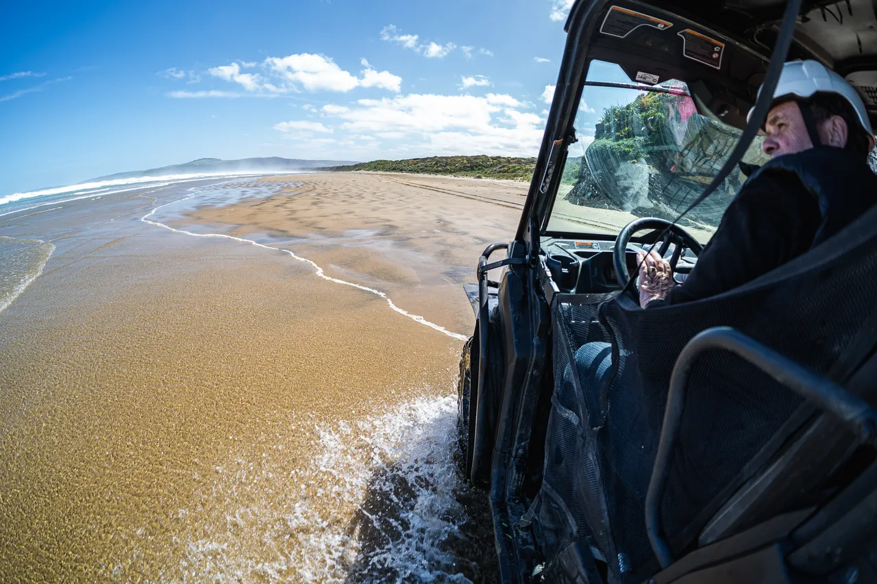 Side by side driving on beach