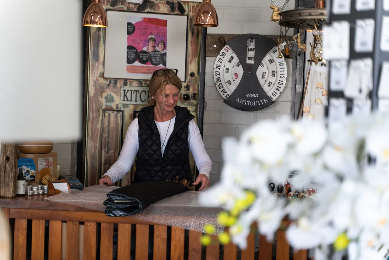 Person behind store counter