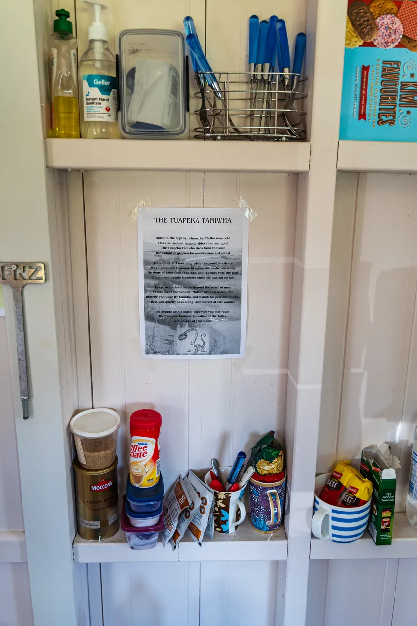 Cupboard with food and mugs