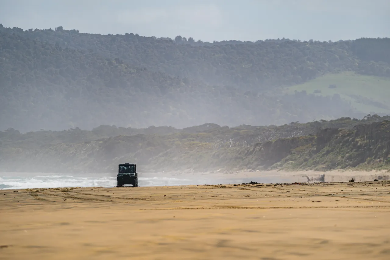 Side by side driving on beach
