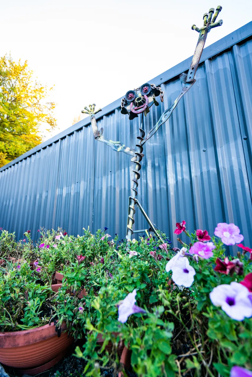 Metal sculpture and flowers