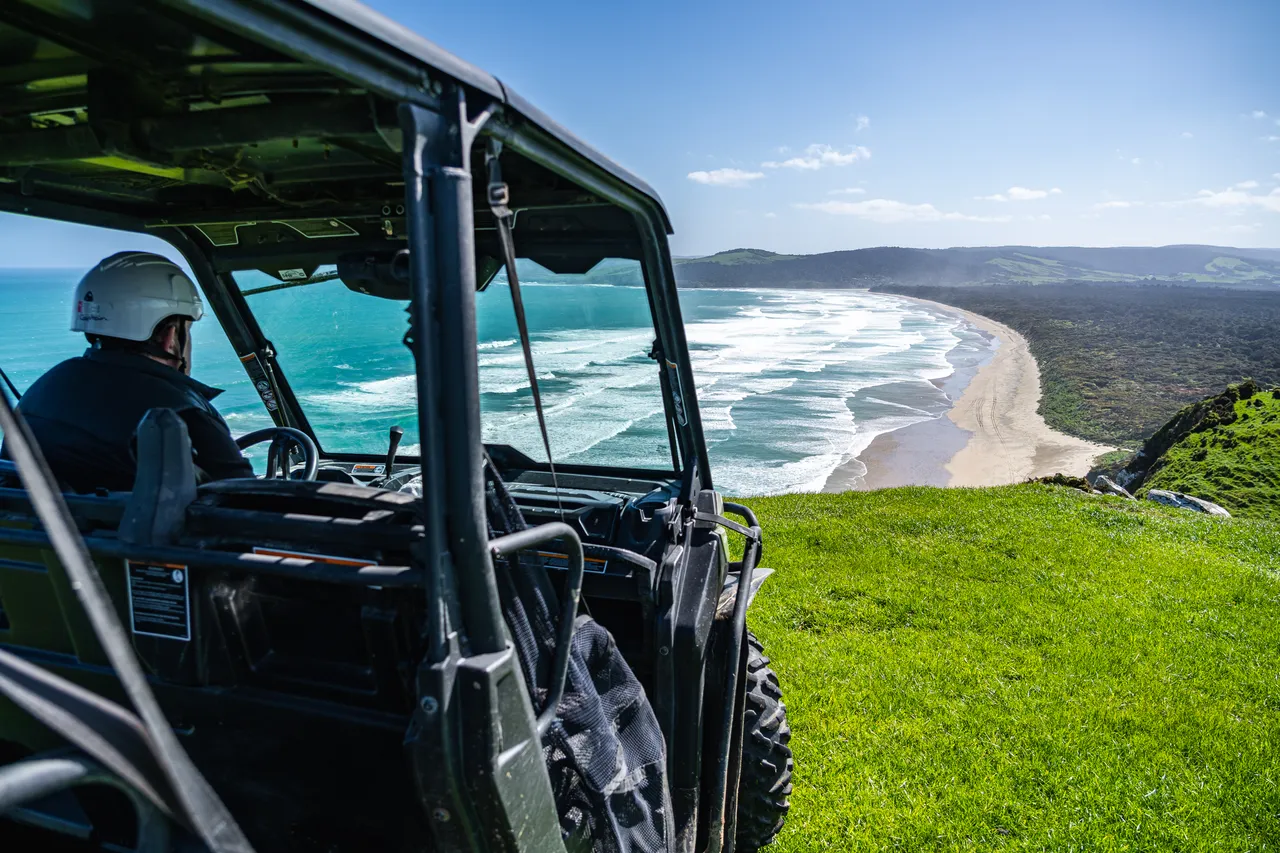 Side by side parked on grass overlooking the sea