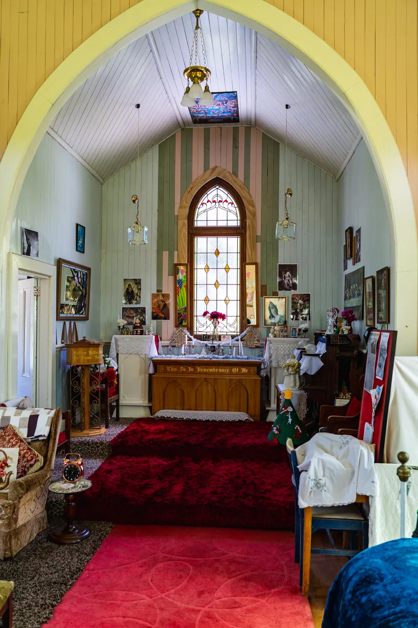 Room with arkwork and rugs