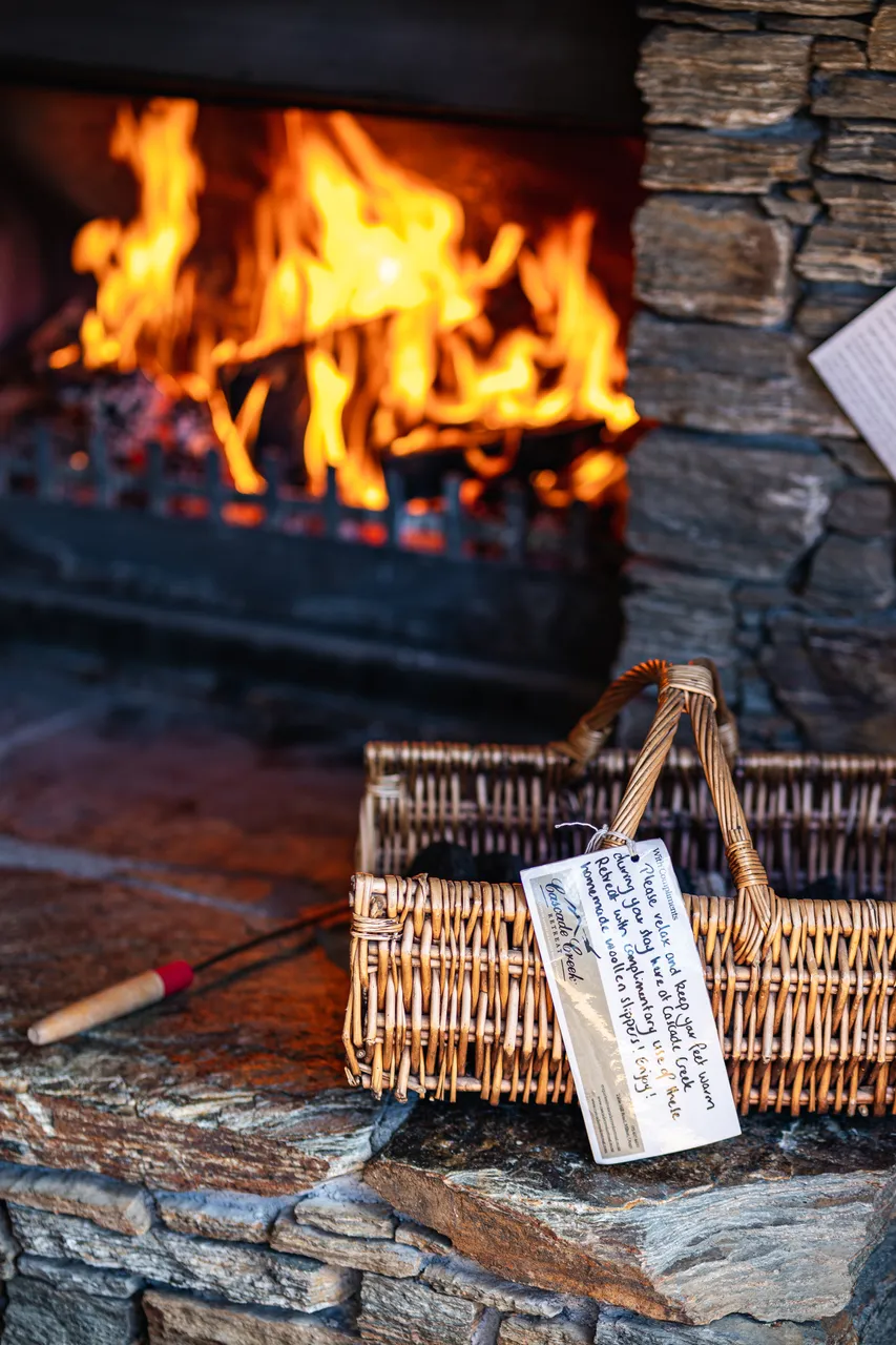 Basket beside fireplace