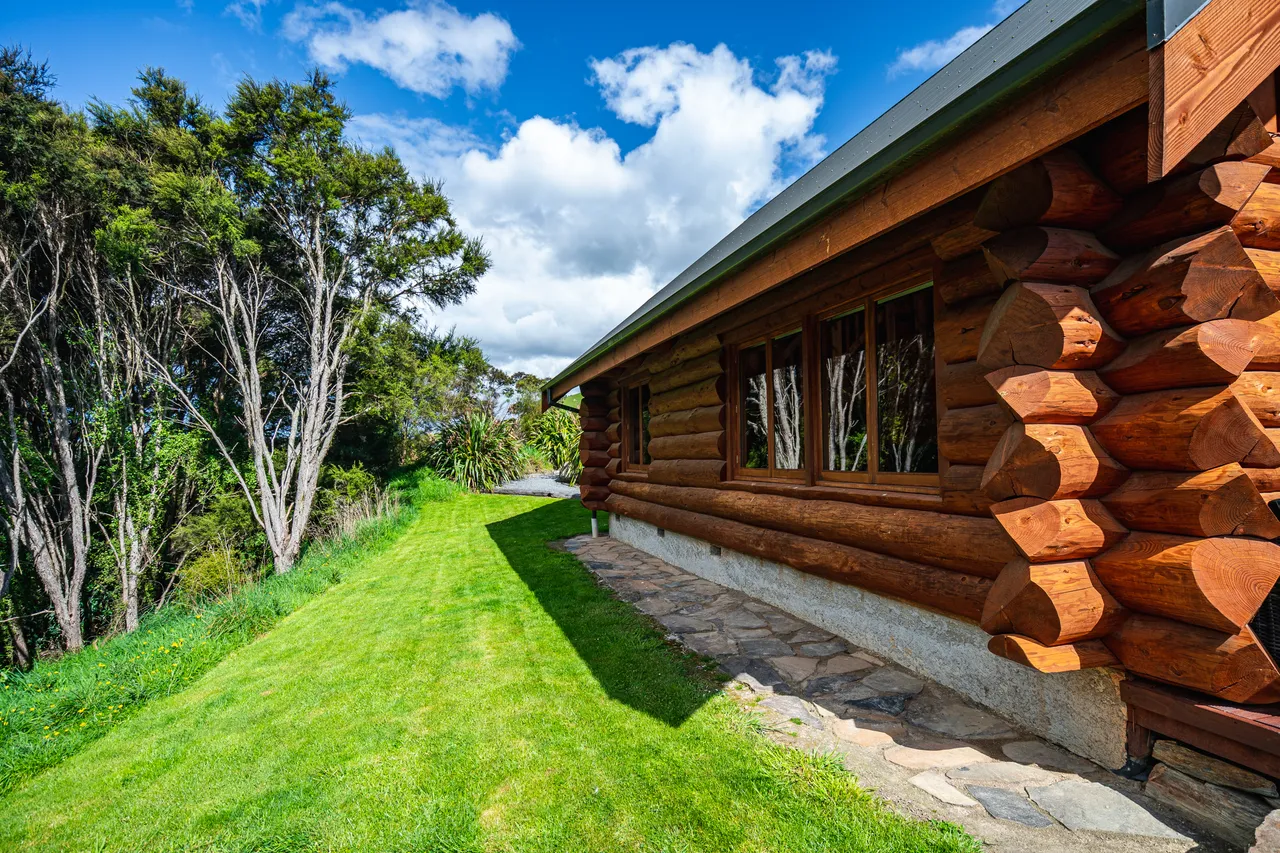 Log cabin on lawn
