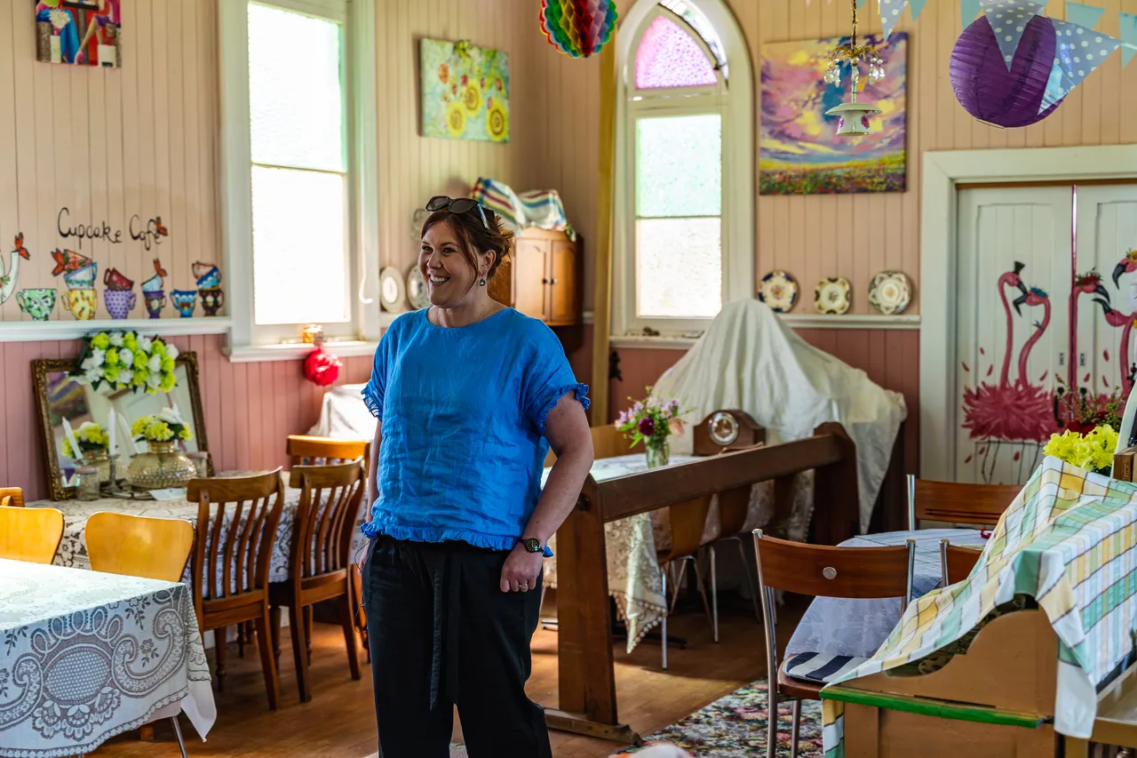 Melissa in room with tables and artwork