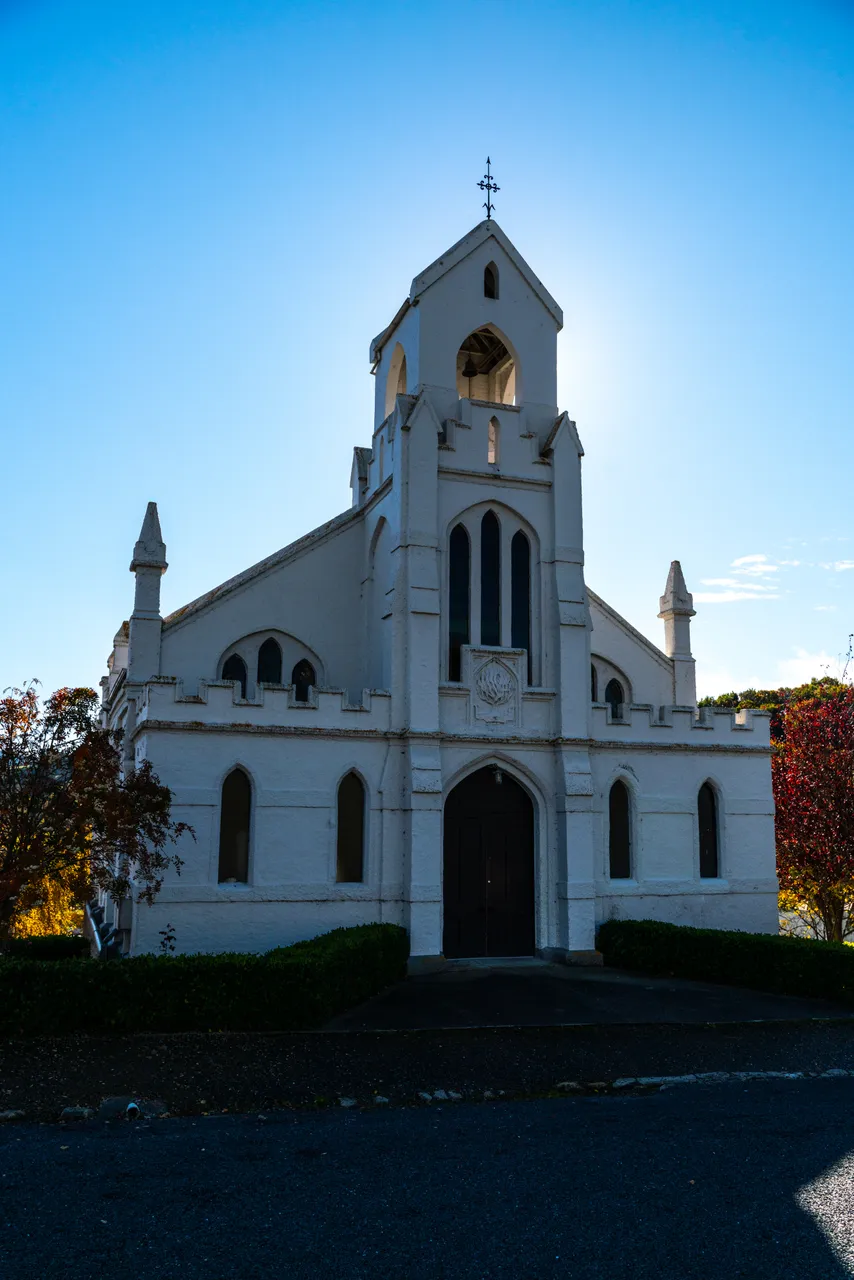 White church and small hedge