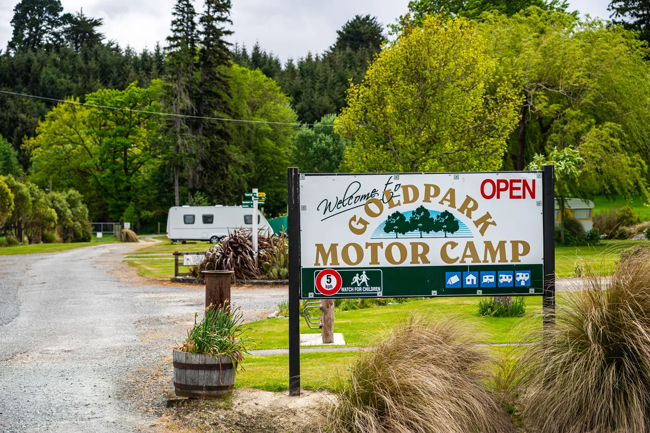 Welcome sign and driveway