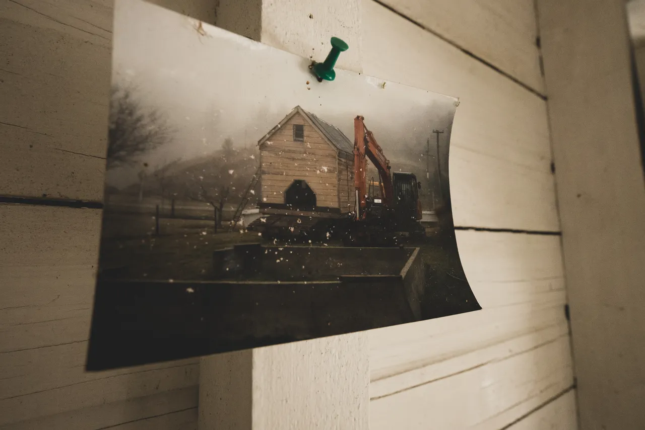 Photograph pinned to wall