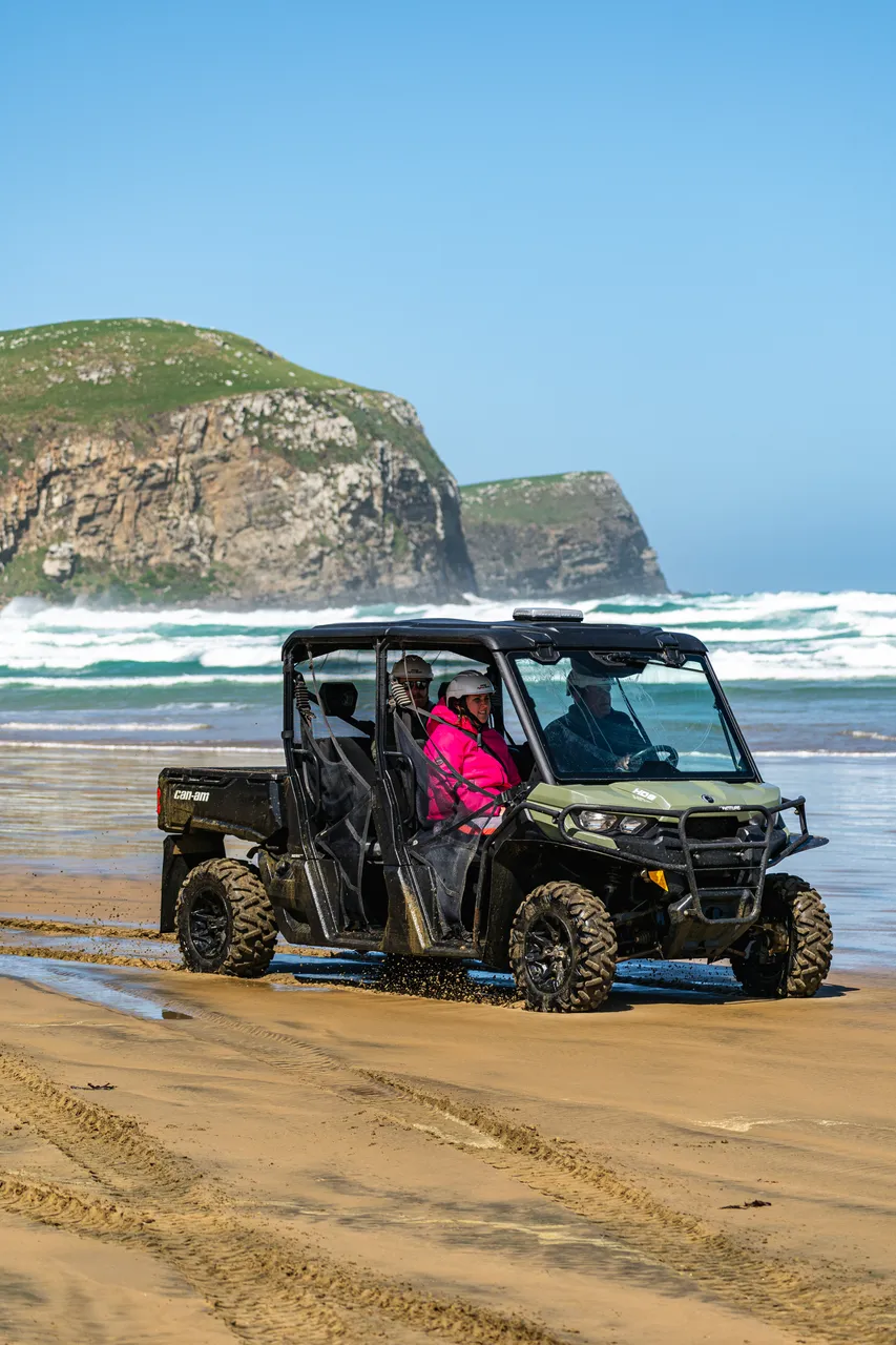 Side by side driving on beach