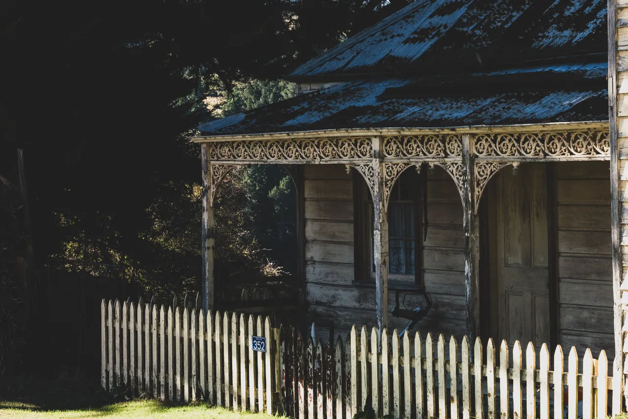 Old building and white fence
