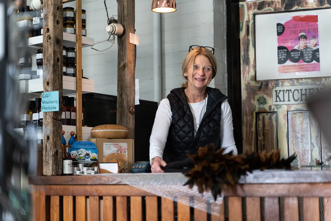 Person behind store counter