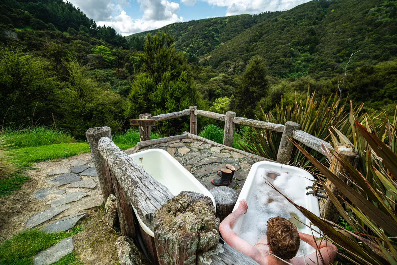 Person in bathtub outside