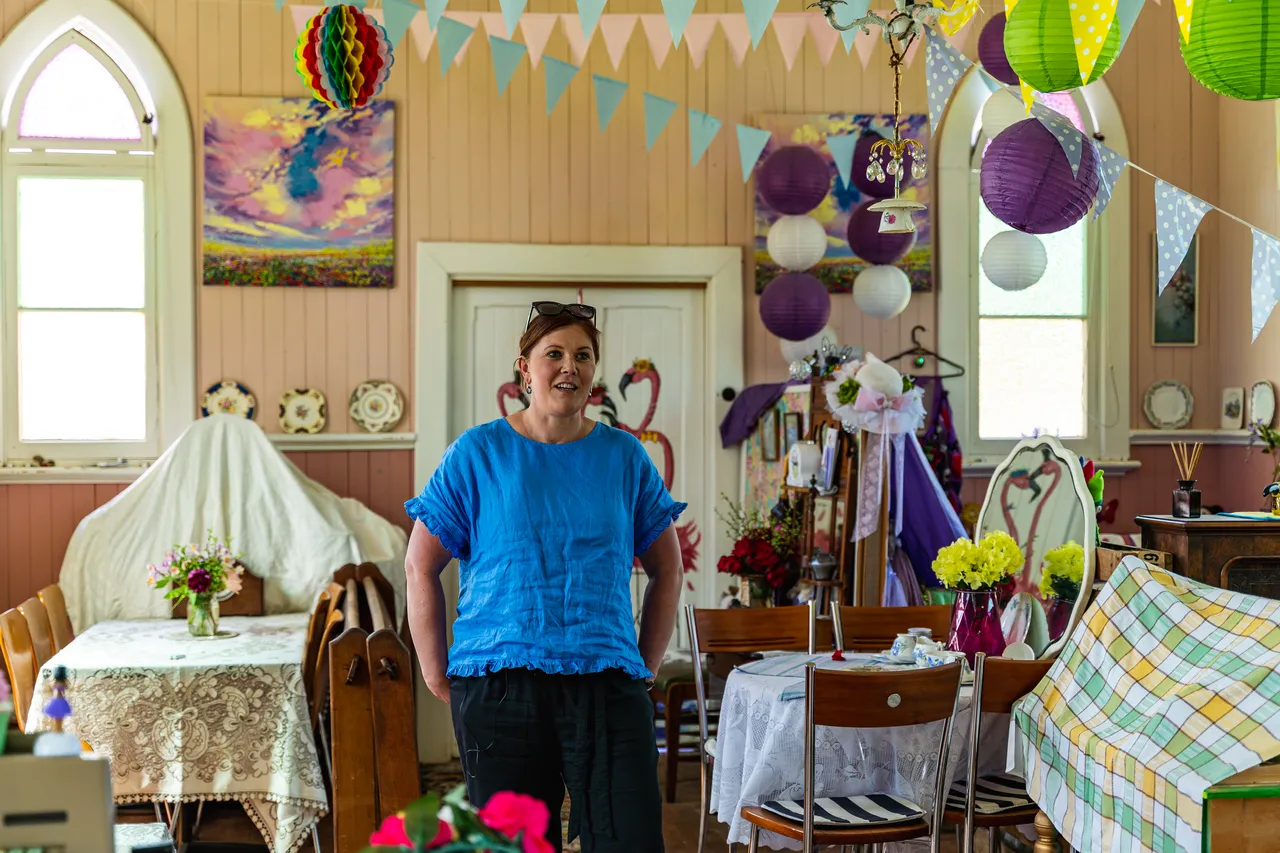 Melissa in room with tables and artwork