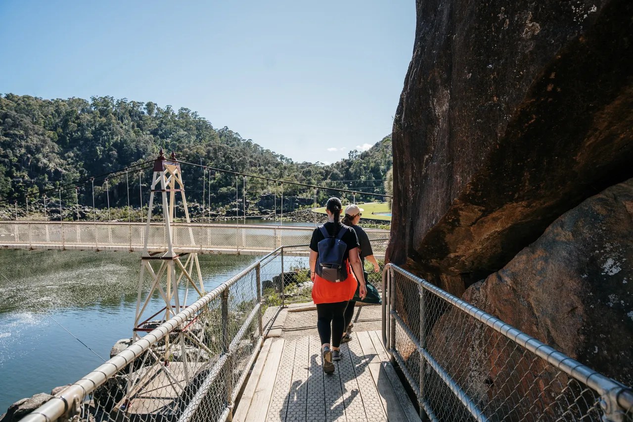 Cataract Gorge walkers, portrait shot towards suspension bridge