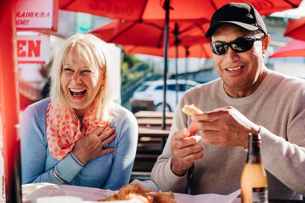 A couple enjoying lunch on the Coastal Pacific train journey stop over.