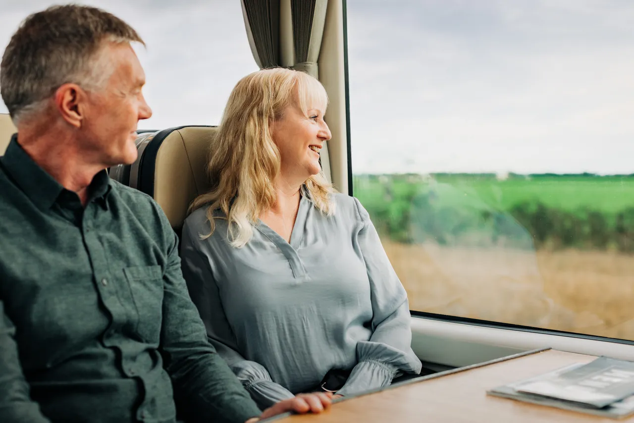 Couple admiring view out of the window