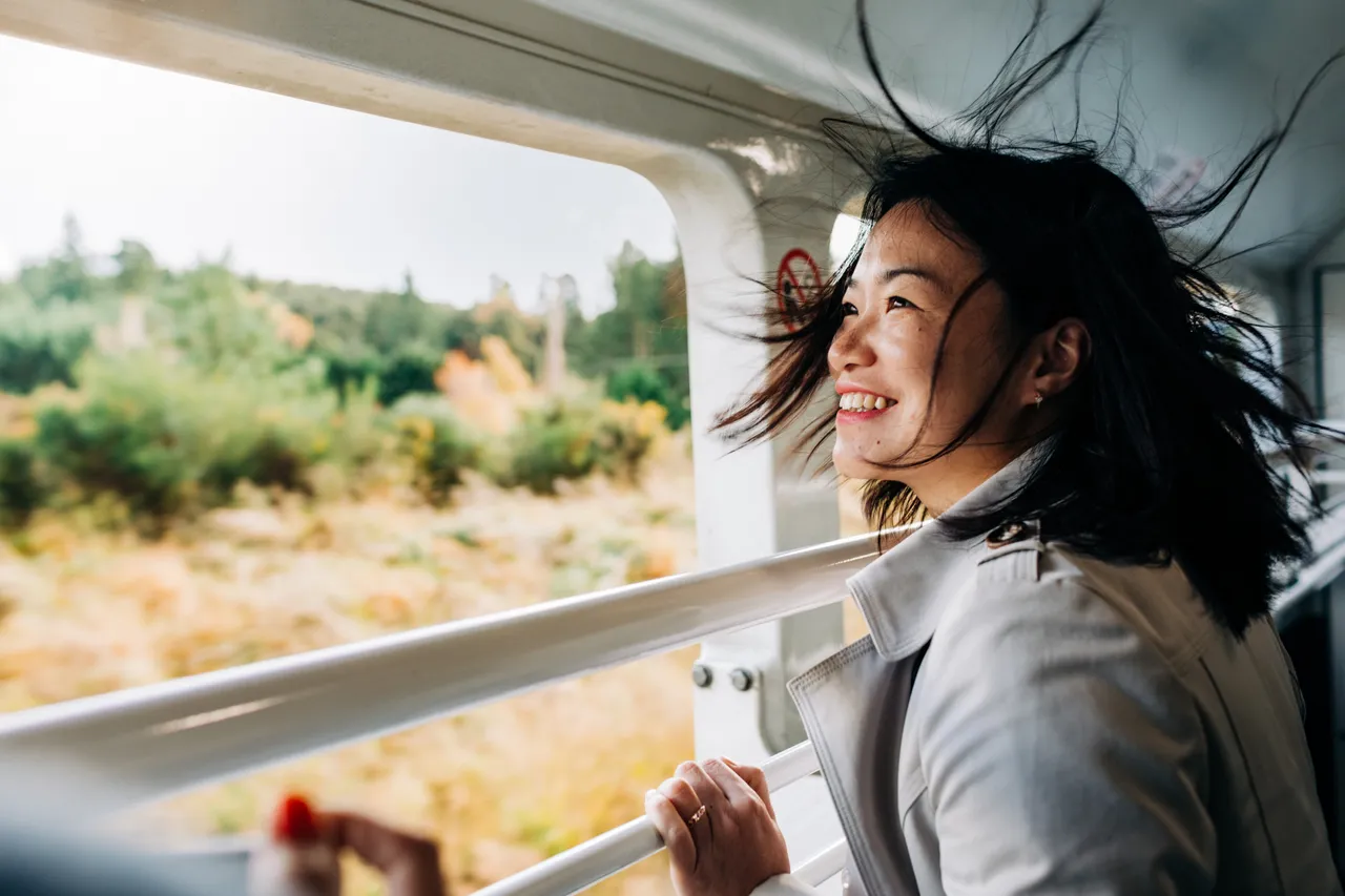 Female passenger catching wind in her hair
