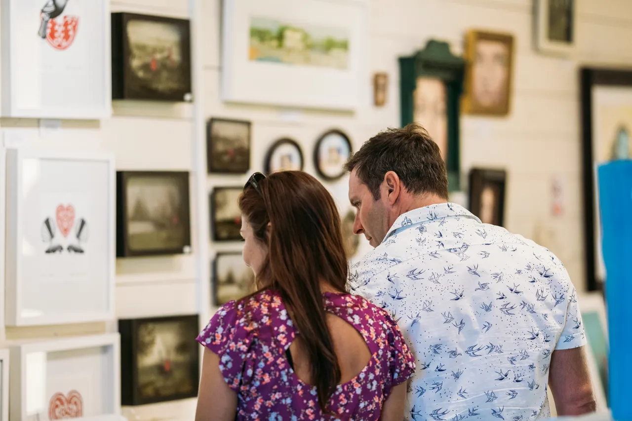 Rear View of Couple Browsing Coolstore Art Gallery on Mapua Wharf