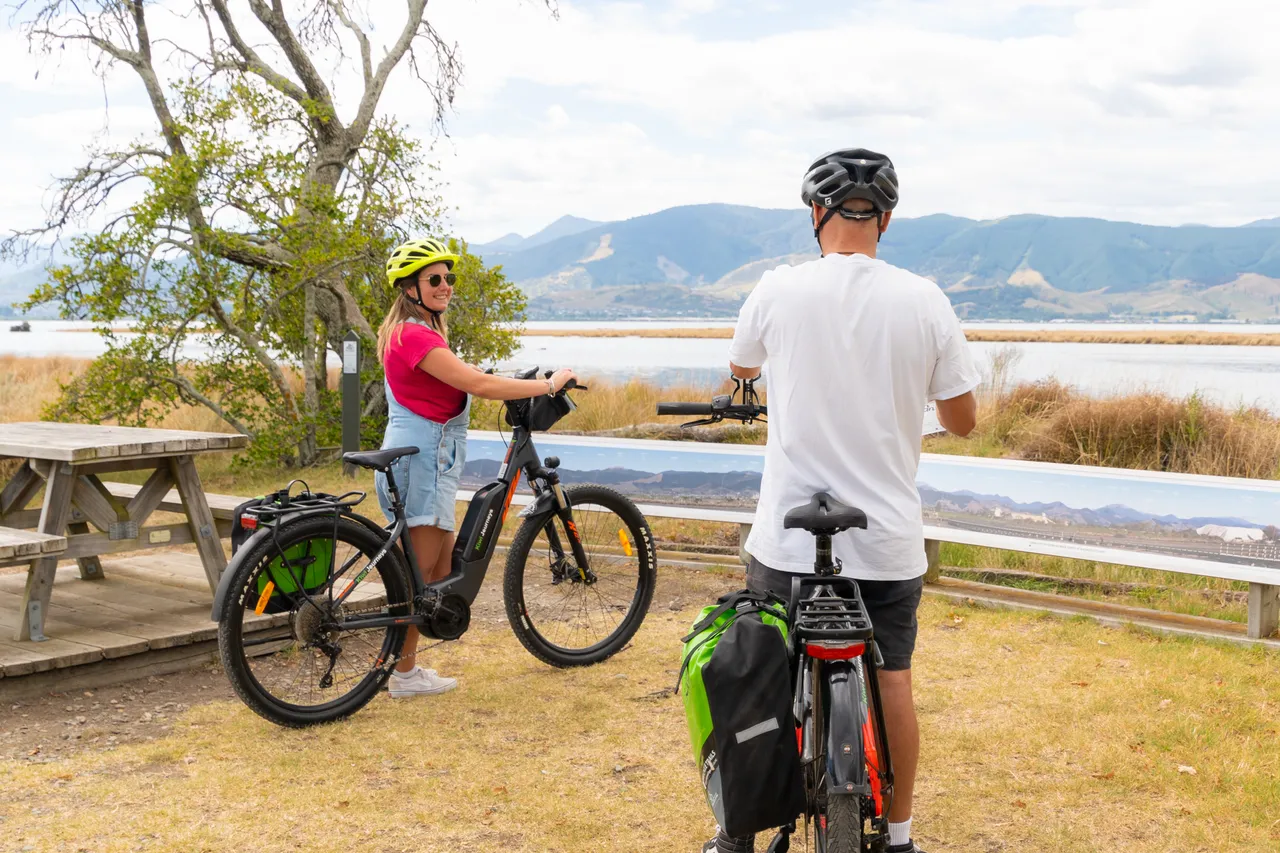 Cyclists Looking out at Waimea Inlet on Tasman's Great Taste Trail