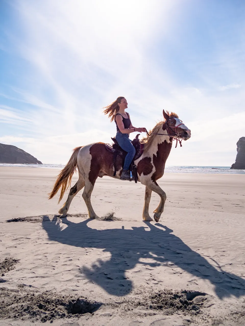 Woman Horseriding on Wharariki Beach