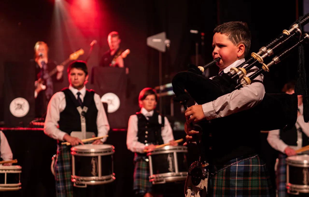 child playing bagpipes