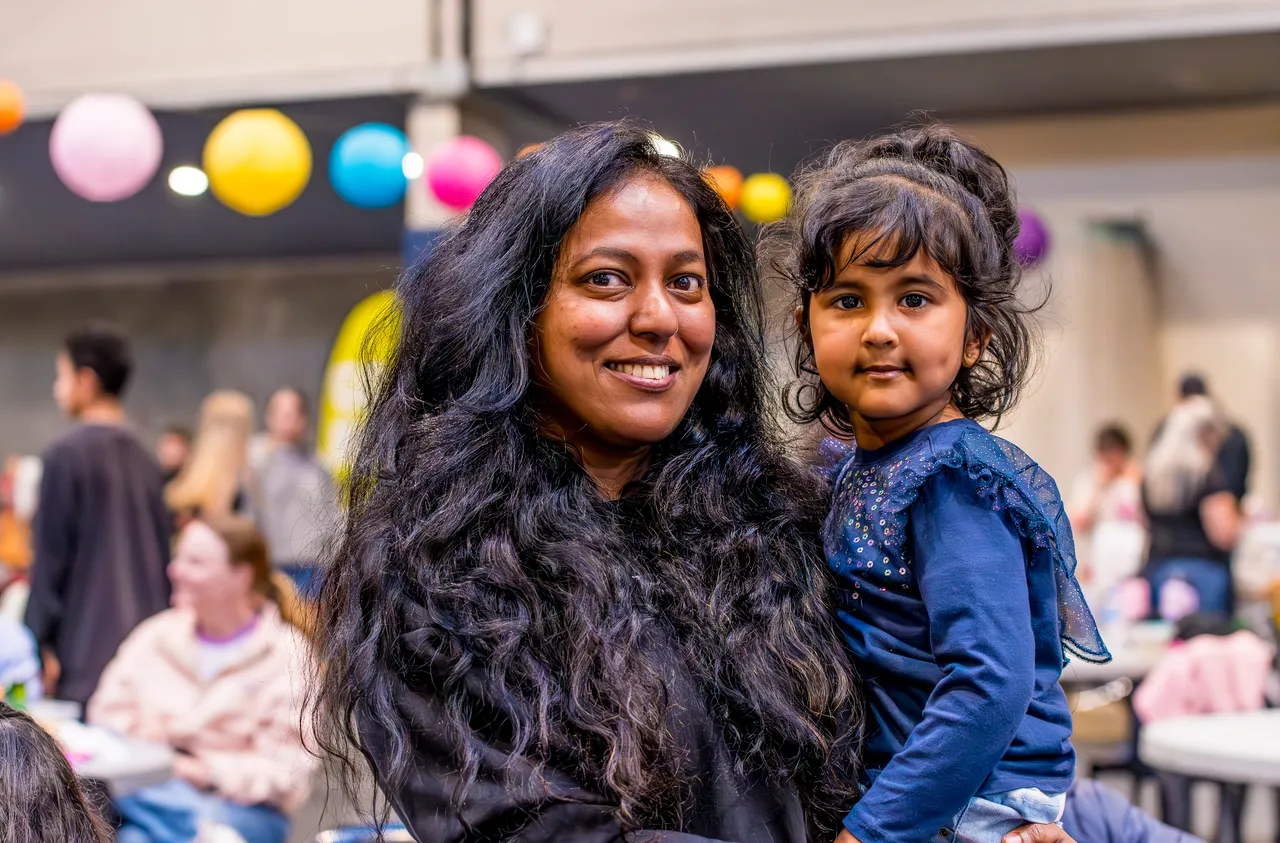 woman holding child in arms