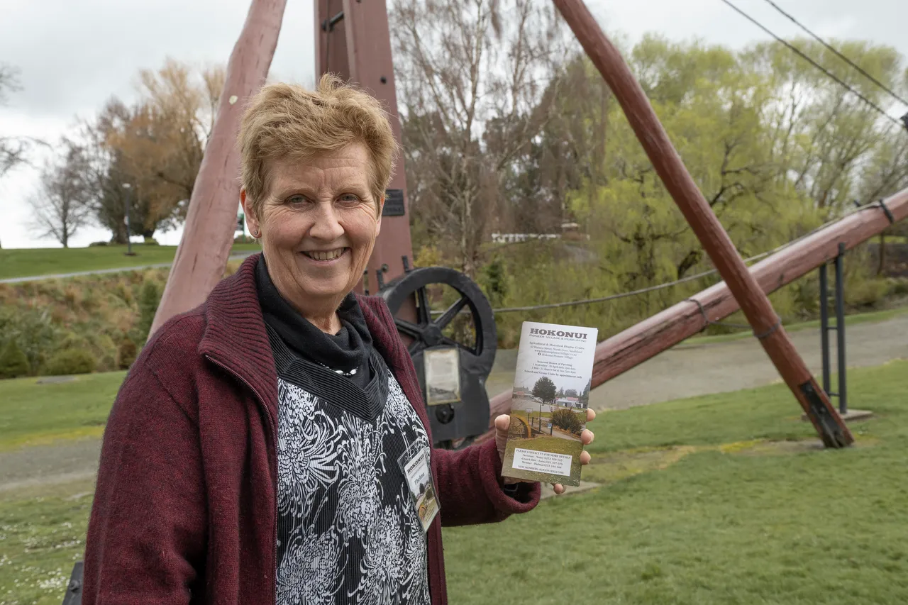 woman holds flyer
