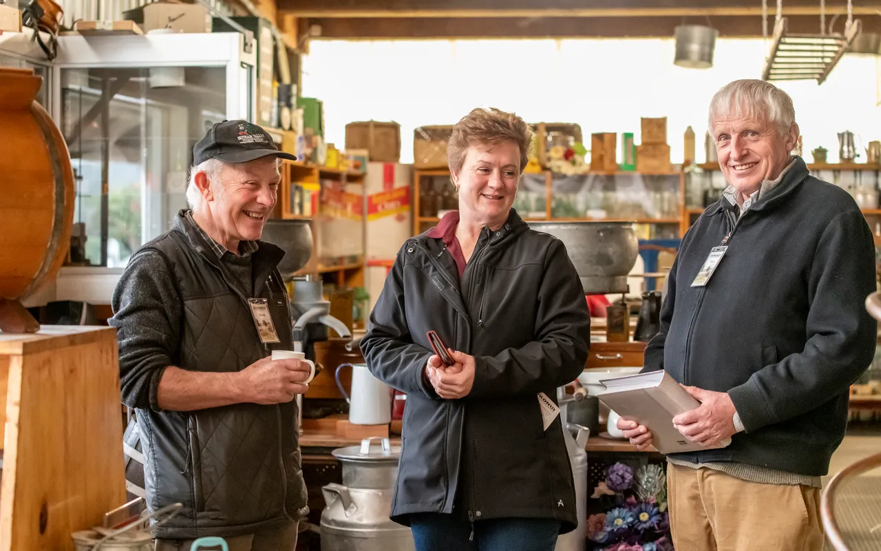 two men and a women chatting