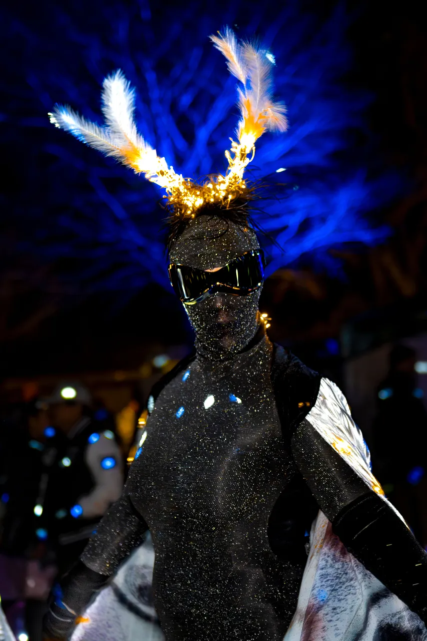 Close up of moth performer with blue background
