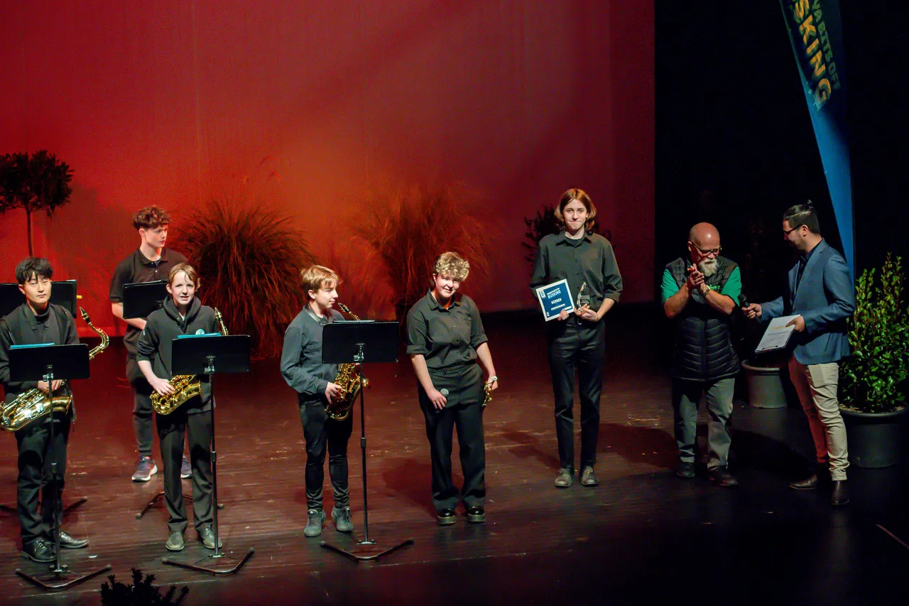A large group of musicianson a stage