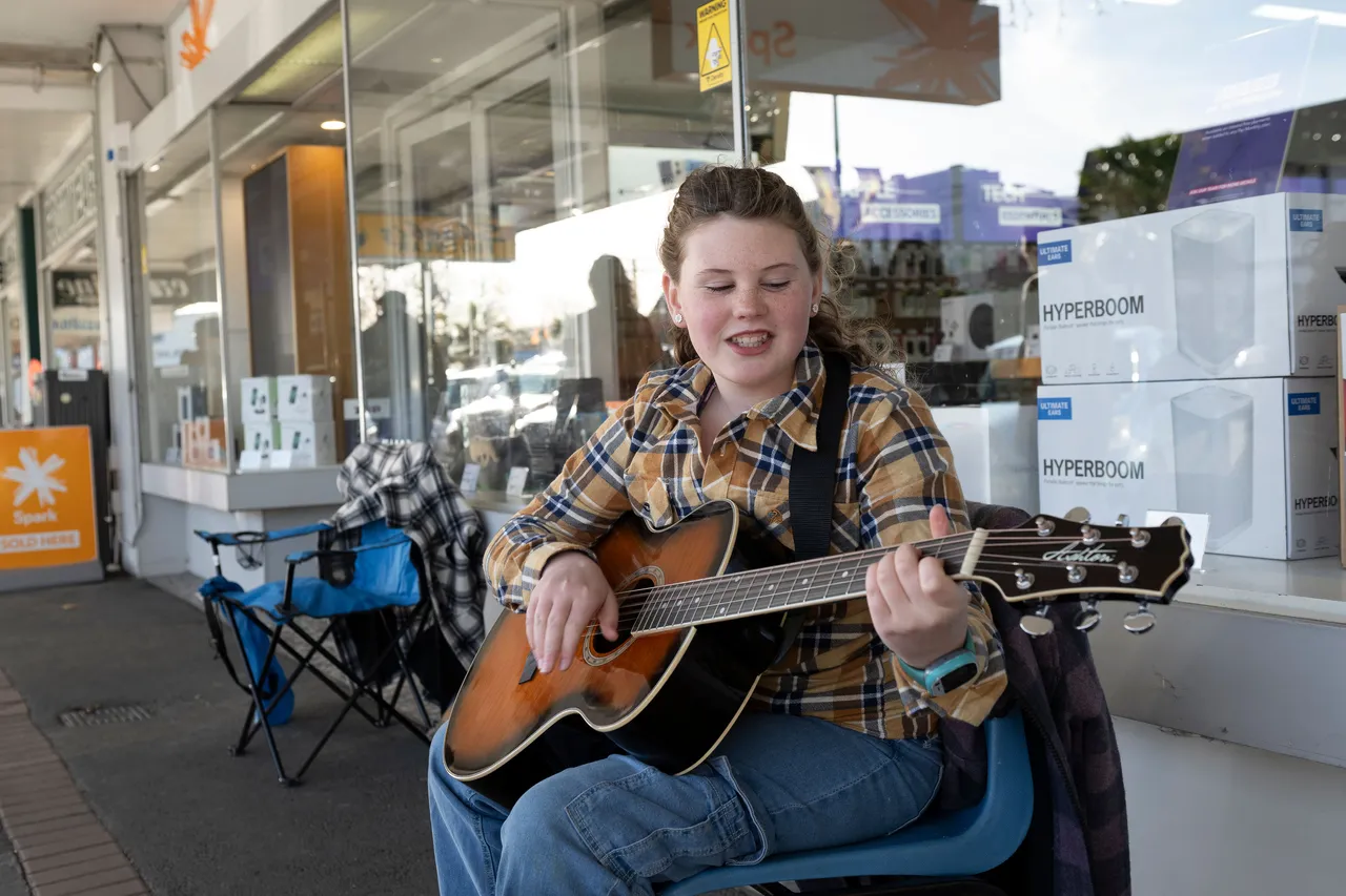 Woman playing guitar