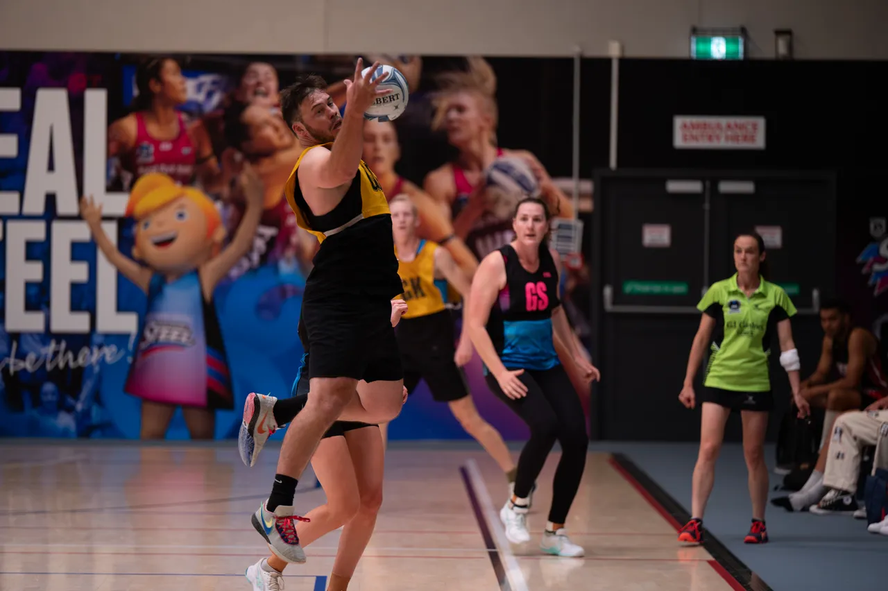 Man catching a Netball