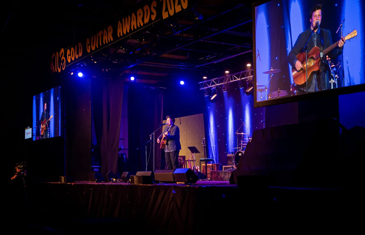 Zac Griffith performs on stage