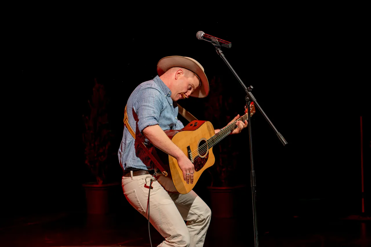 Man playing guitar on stage